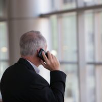 Business Alliance, Inc. franchise broker business businessman speaks on the phone
