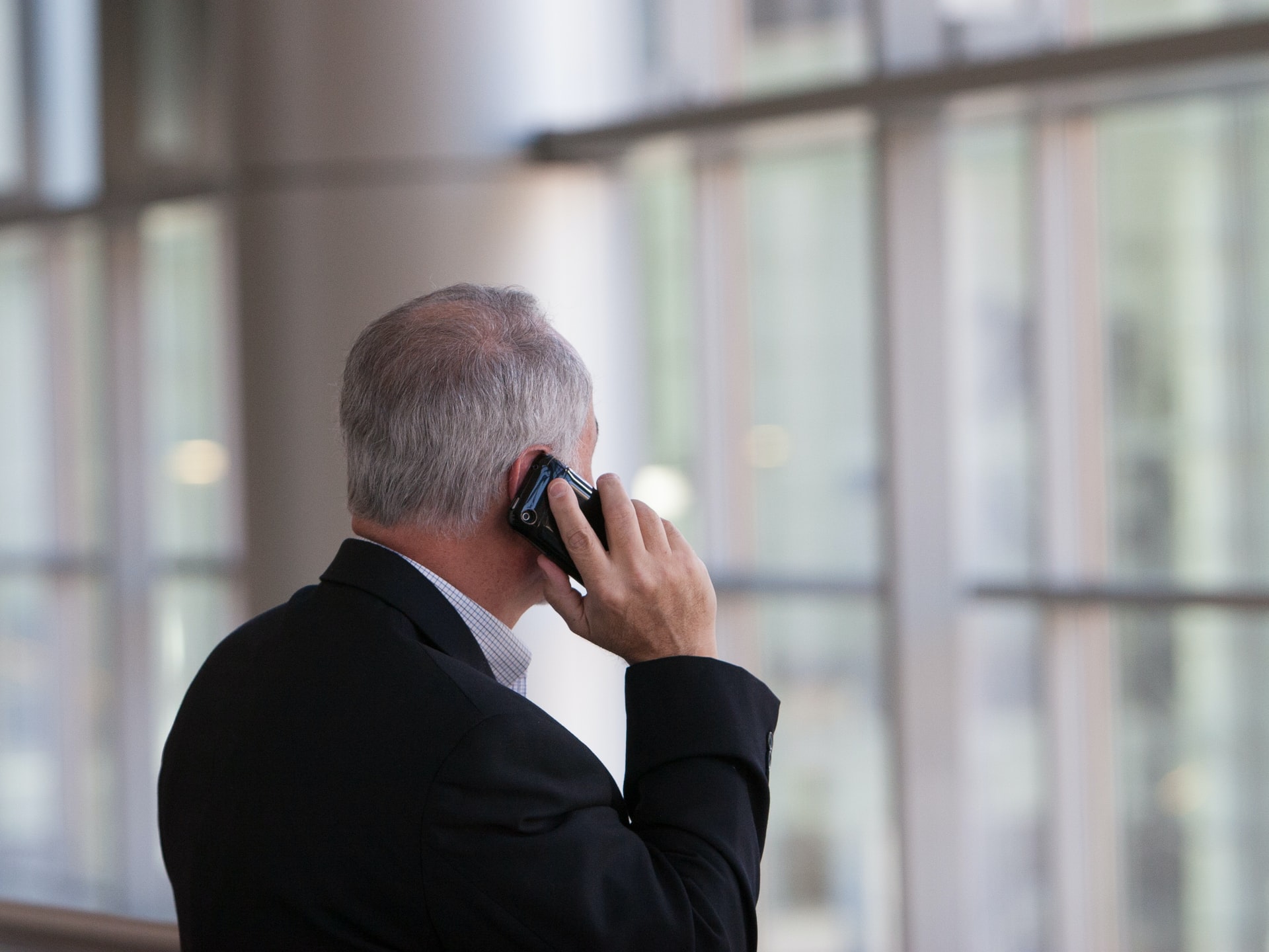 Business Alliance, Inc. franchise broker business businessman speaks on the phone